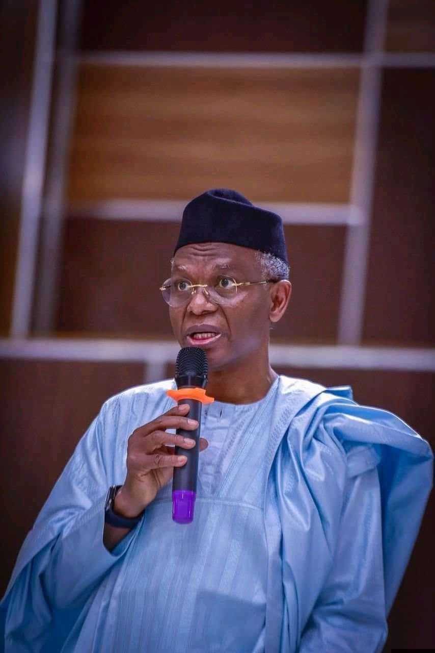 Mallam Nasir El-Rufai standing in traditional attire